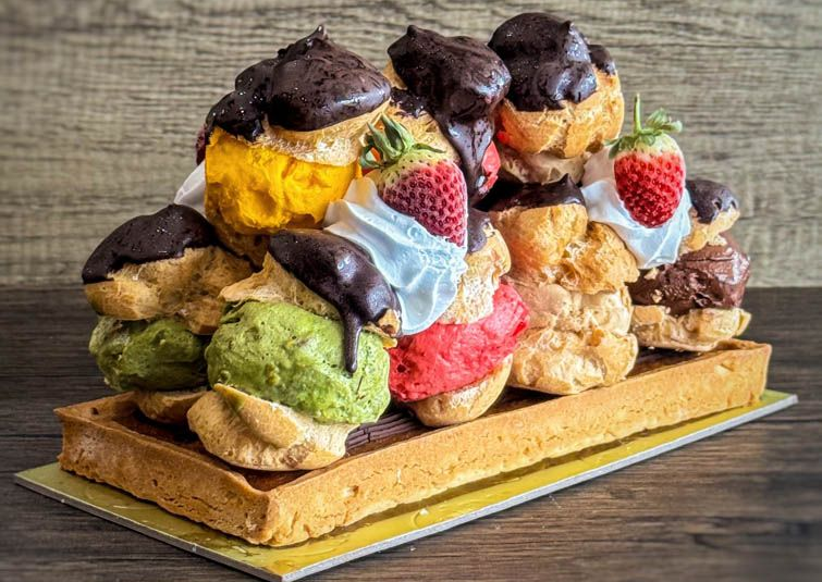 three profiterole cakes