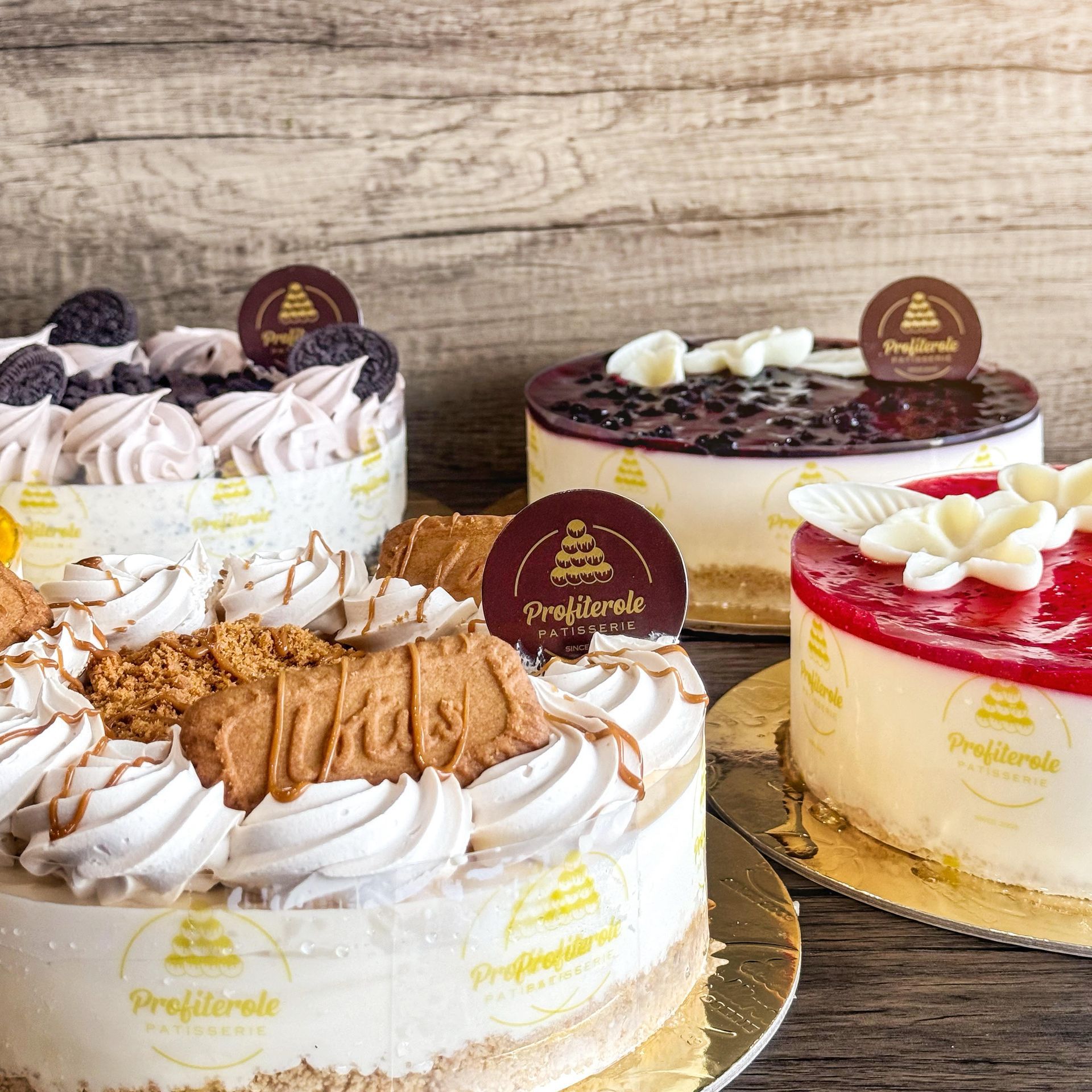 four cheesecakes on a grey background