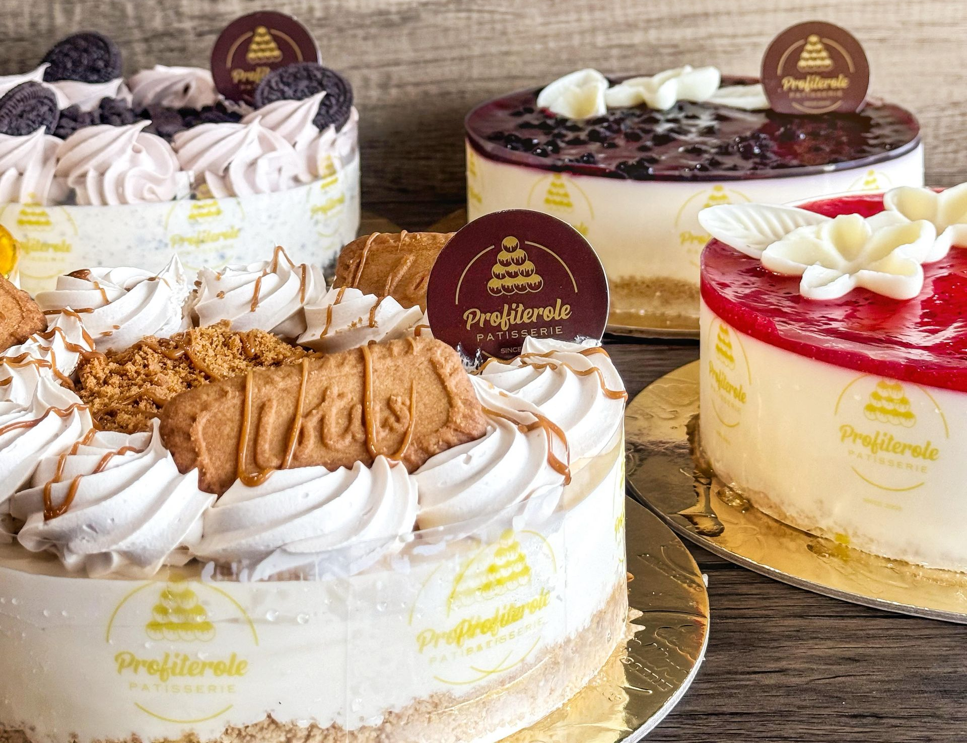 four cheesecakes on a grey background