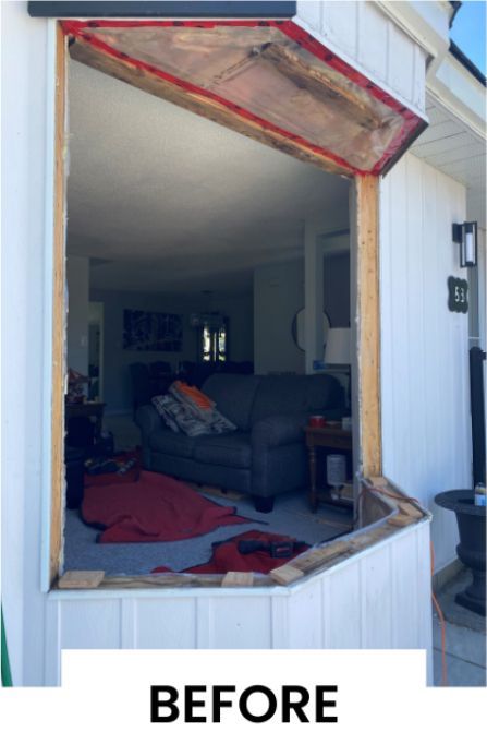 A before picture of a living room with a bay window