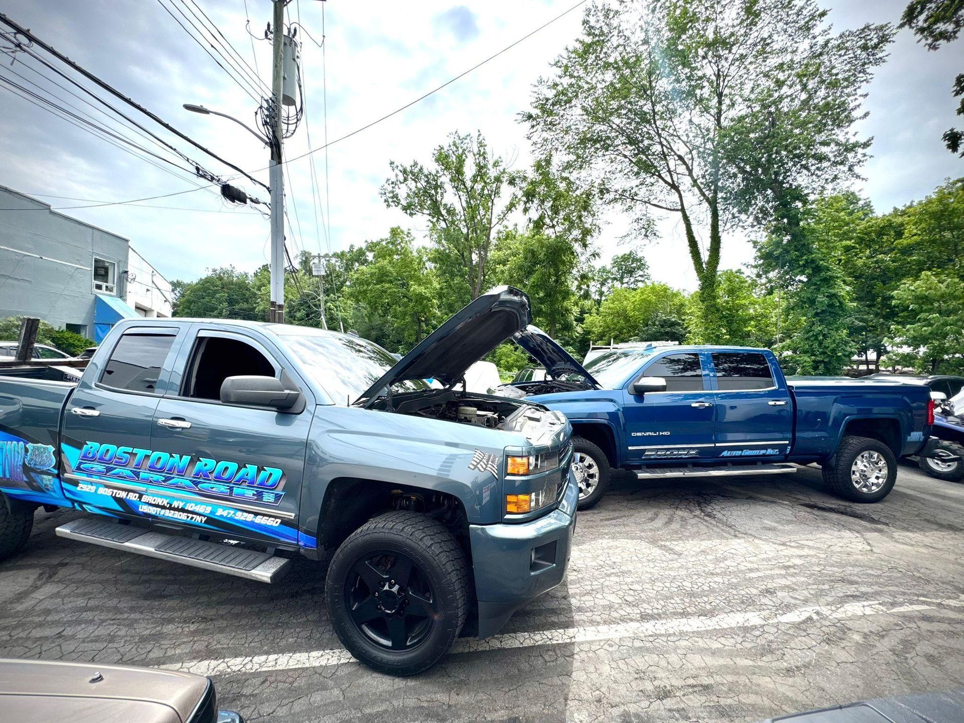 Two pickup trucks parked outdoors.
