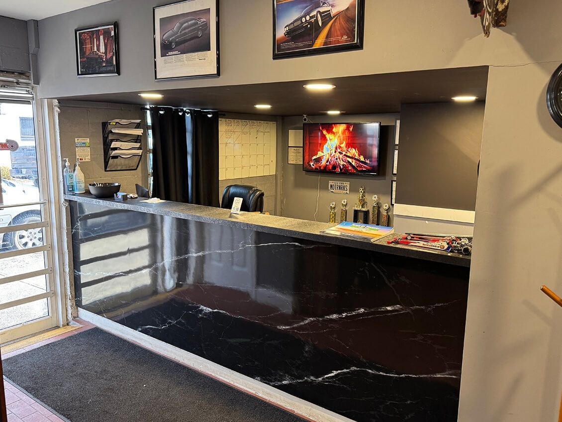 Front Desk Lobby Area With Reception Counter | Motorwerks Inc