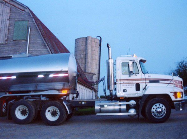 Large trucks come to the farm to pick up the milk