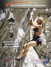 A woman in a bikini is climbing a rock wall.