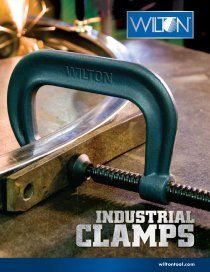 A wilton industrial clamp is sitting on a piece of metal