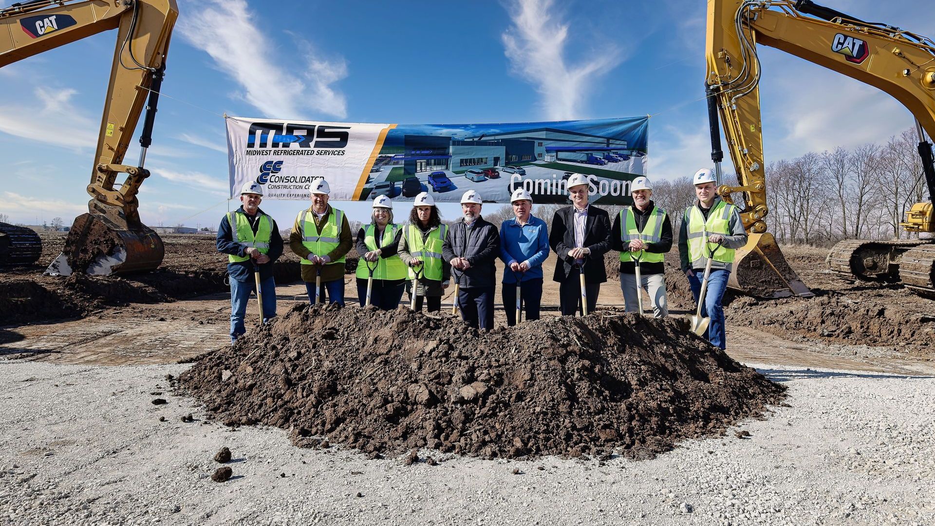 MRS and Consolidated Construction Co. posing during the groundbreaking event.