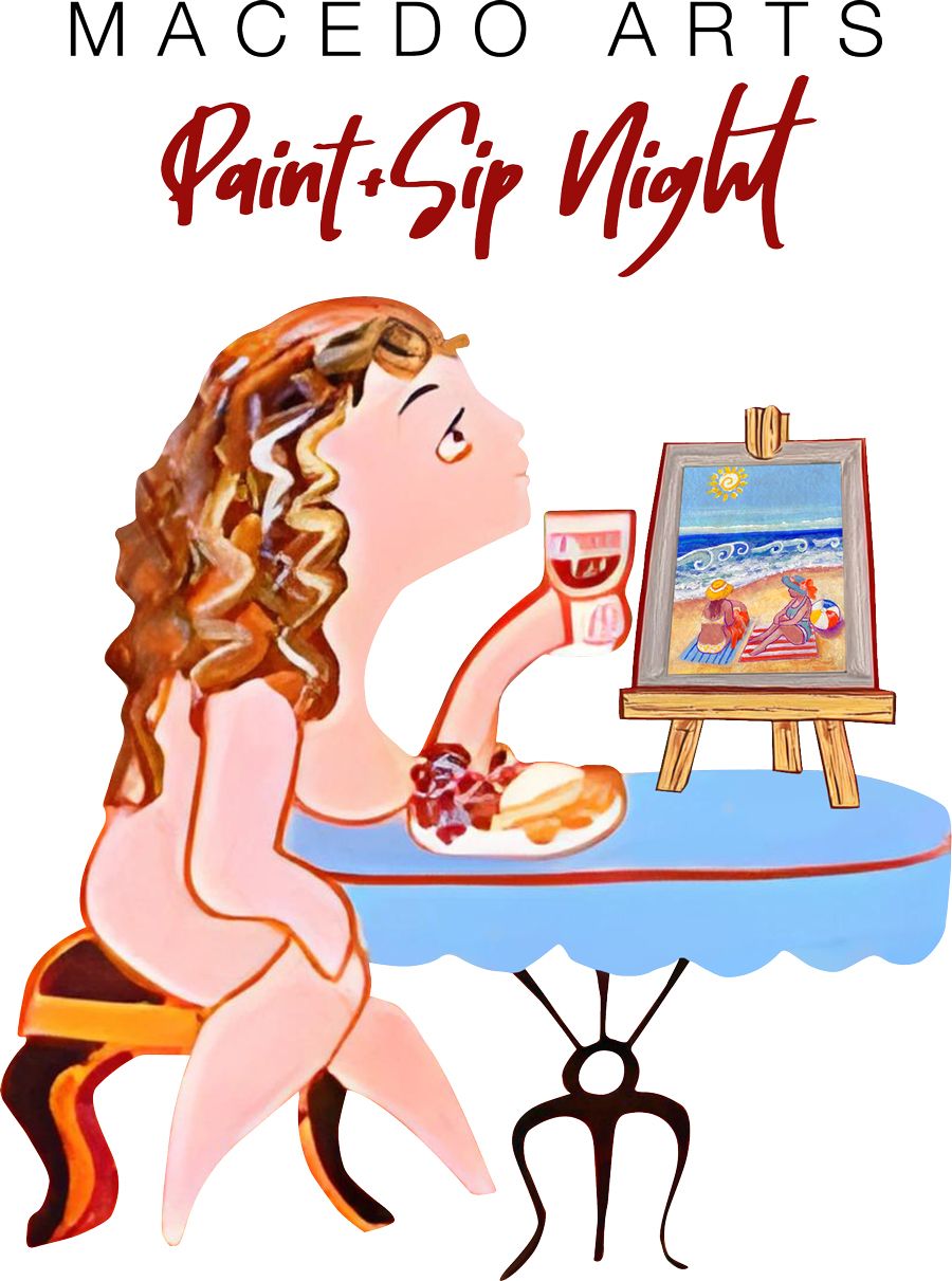 A woman sits at a table with a sign that says paint & sip