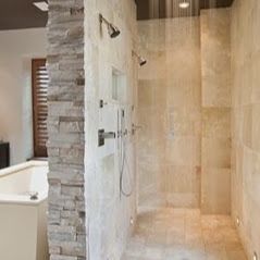 A bathroom with a walk in shower and a bathtub Bathroom Remodel New Orleans LA