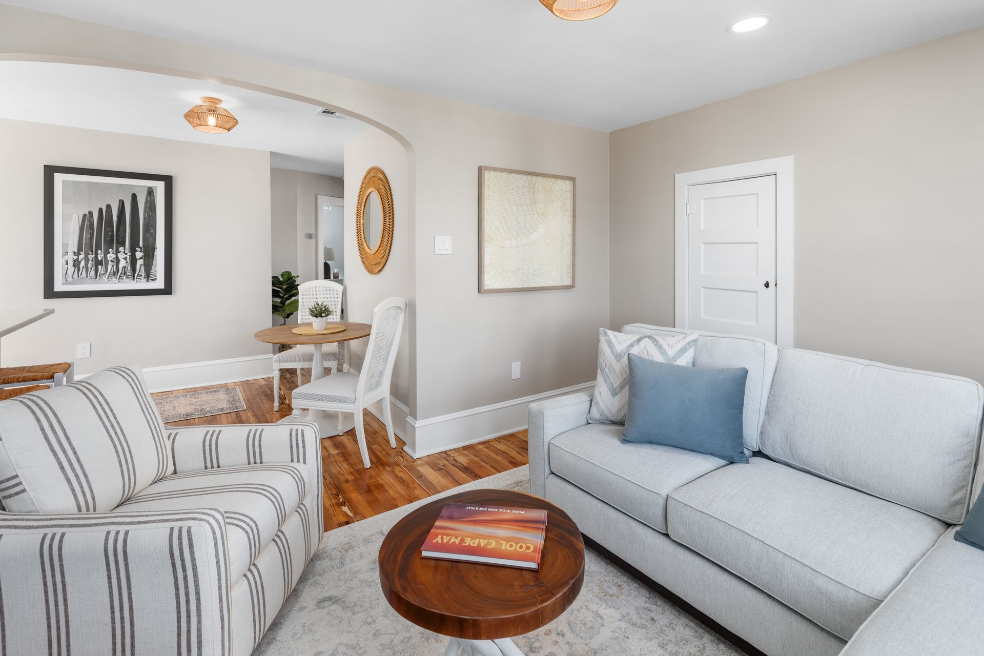 A living room with a couch , chair , and table.