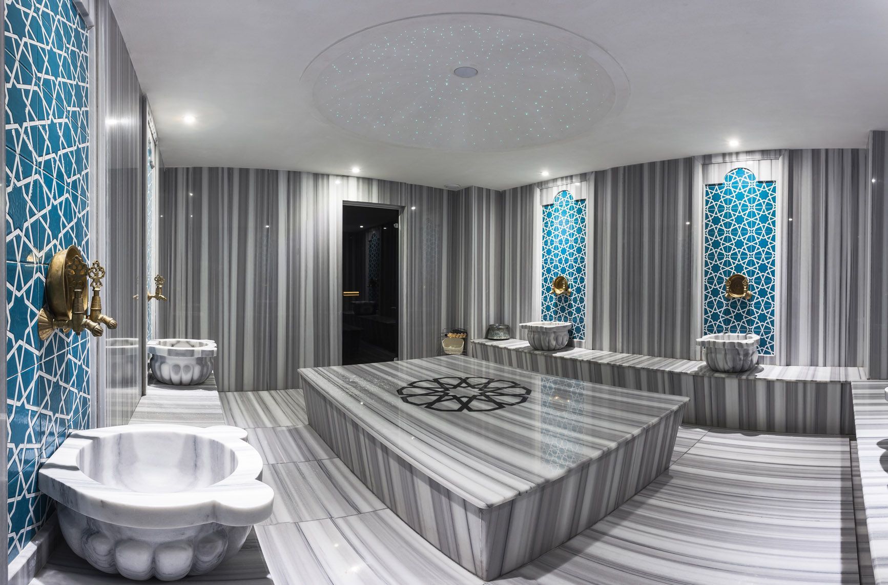 There is a large bathtub in the middle of the room.