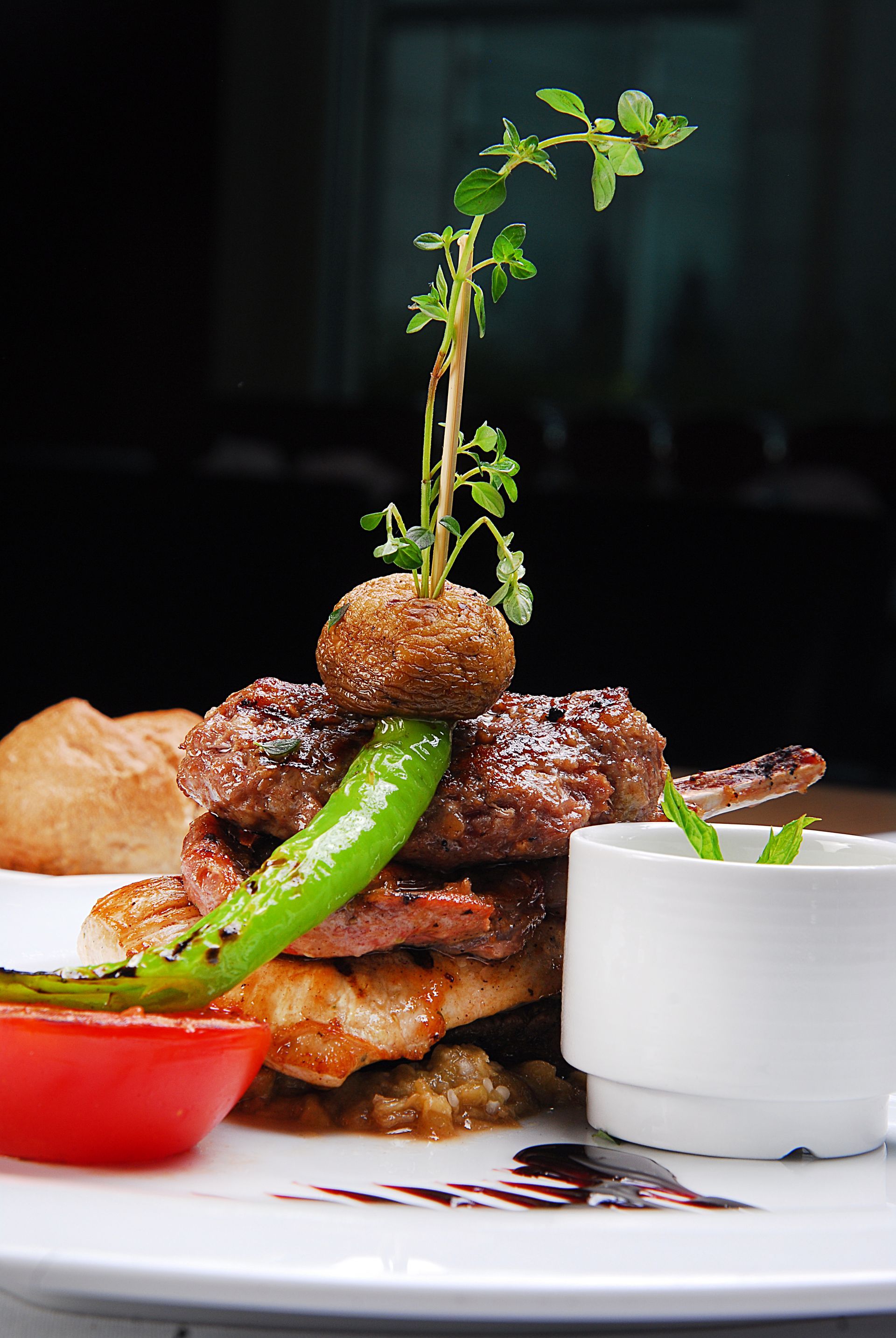 A plate of food with meat and vegetables on a table.