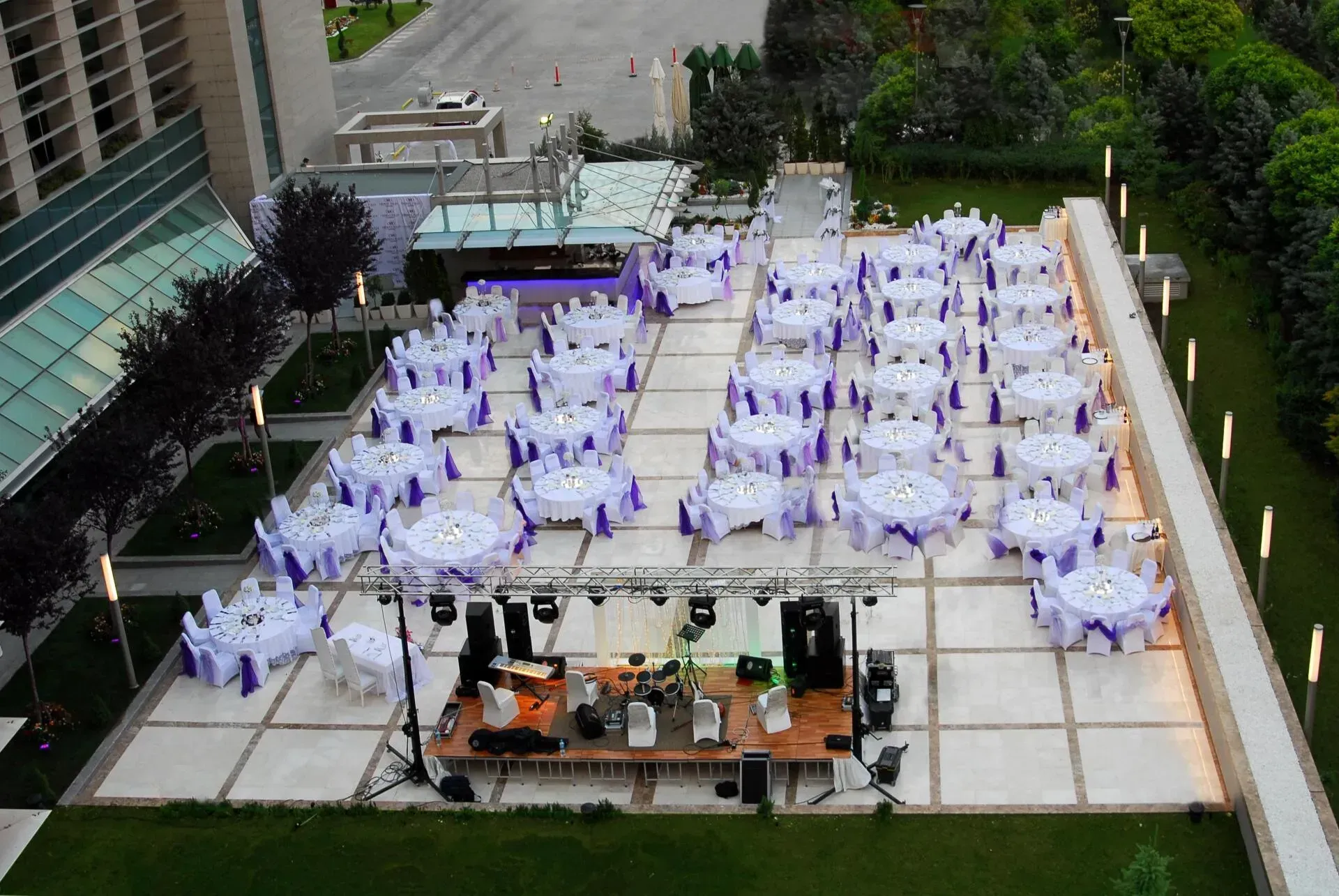 An aerial view of tables and chairs set up for a wedding reception