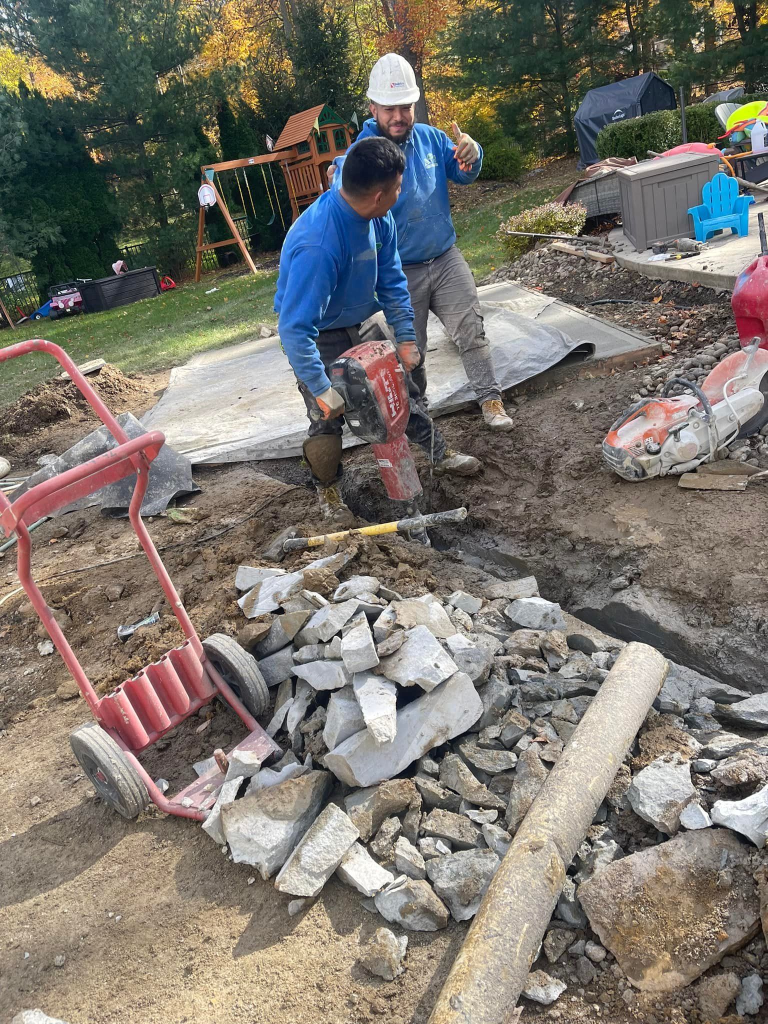 A couple of men are working on a construction site.