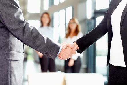 Auto Insurance — Two men Shaking hands while 2 girls are watching in East and West, AL