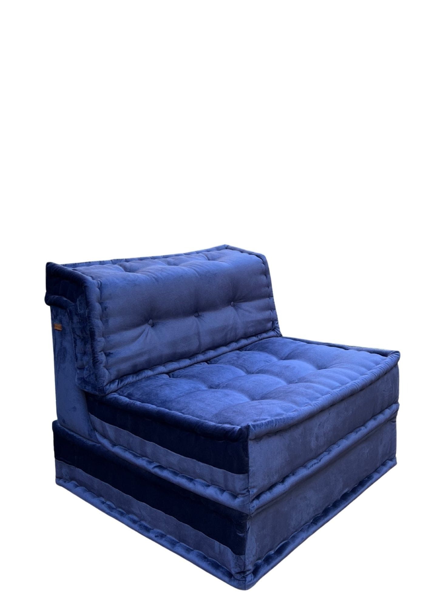 Poltrona modulare imbottita in velluto blu.