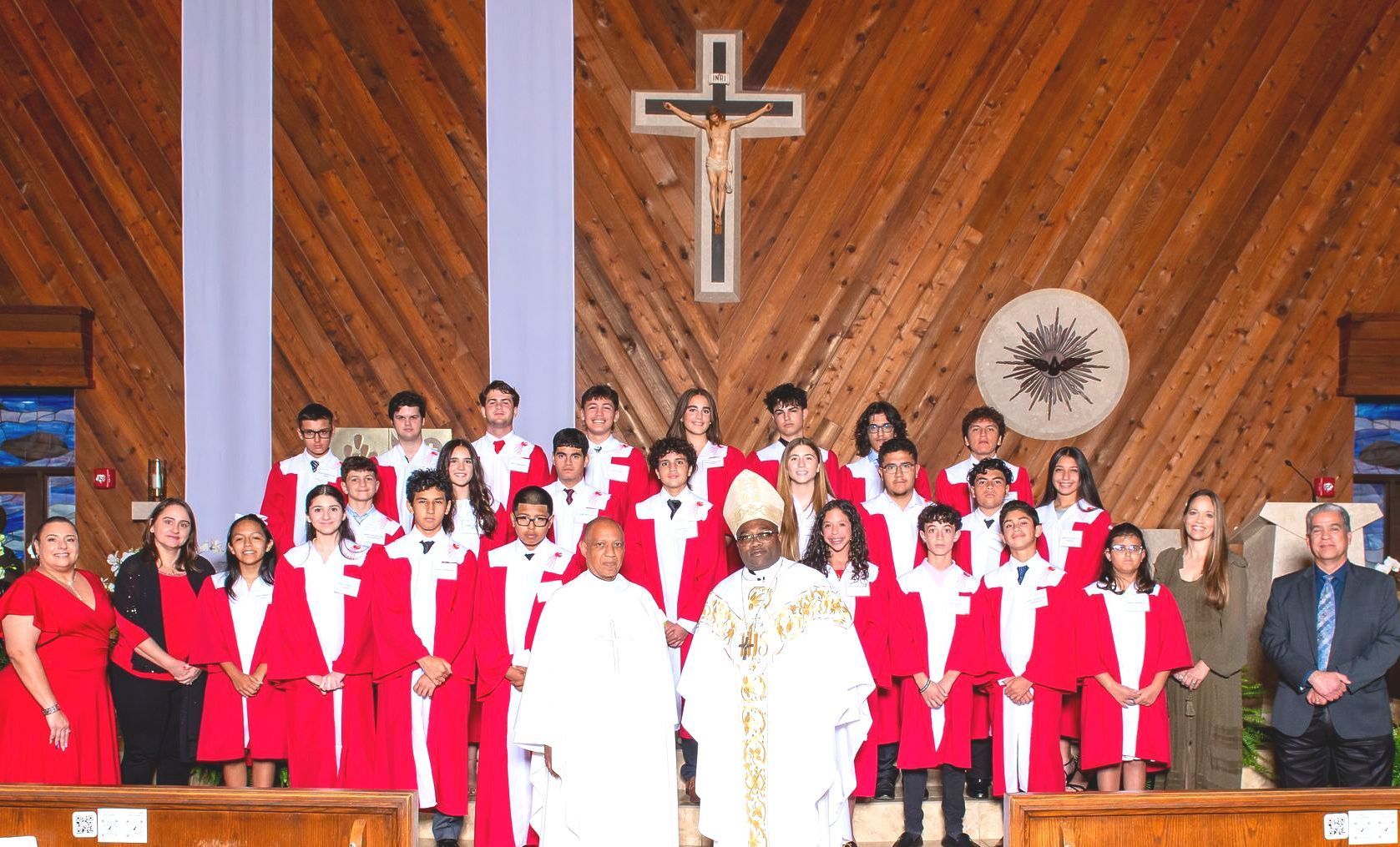 A group of people are posing for a picture in a church