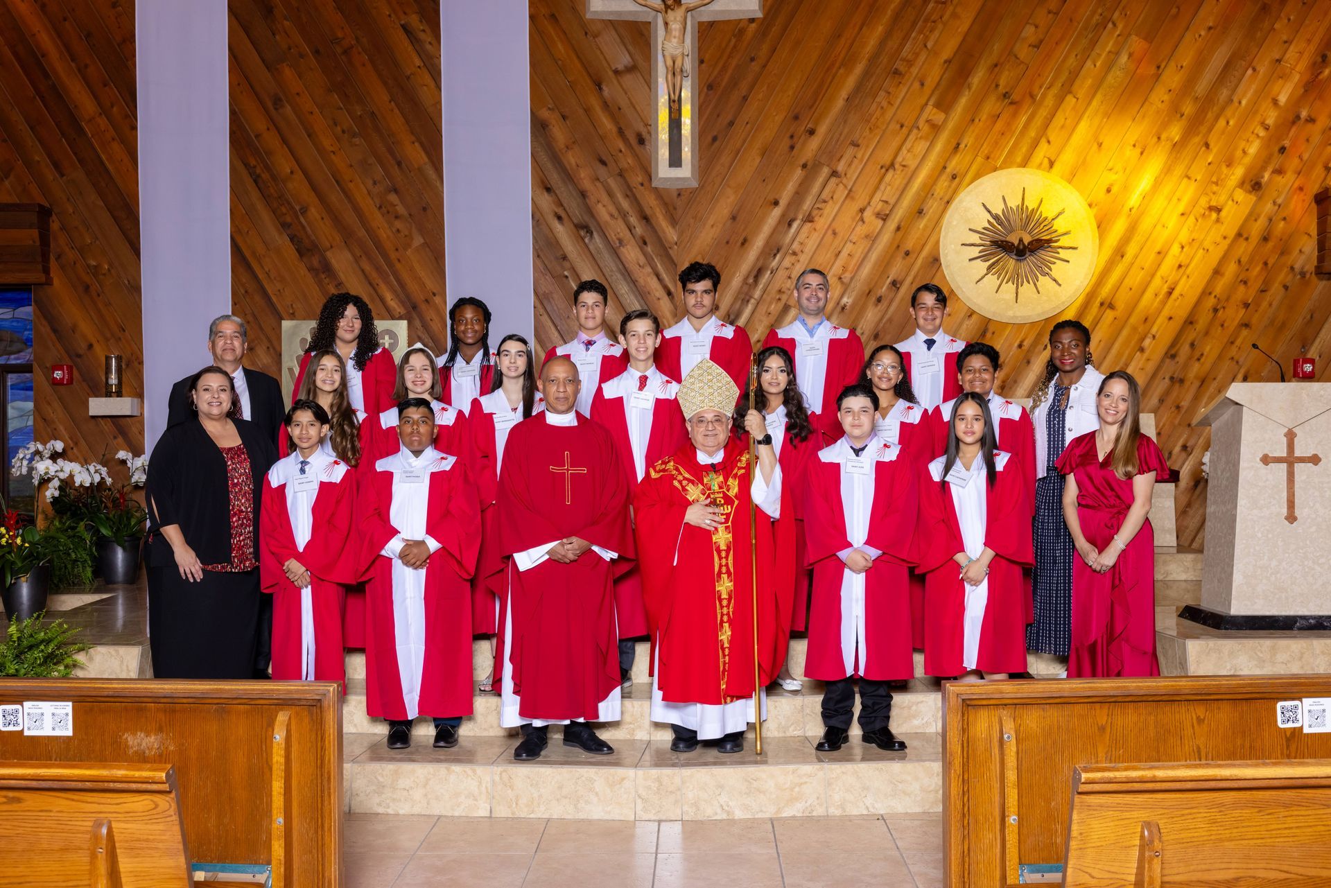 A group of people are posing for a picture in a church