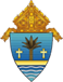A shield with a palm tree and two crosses on it.