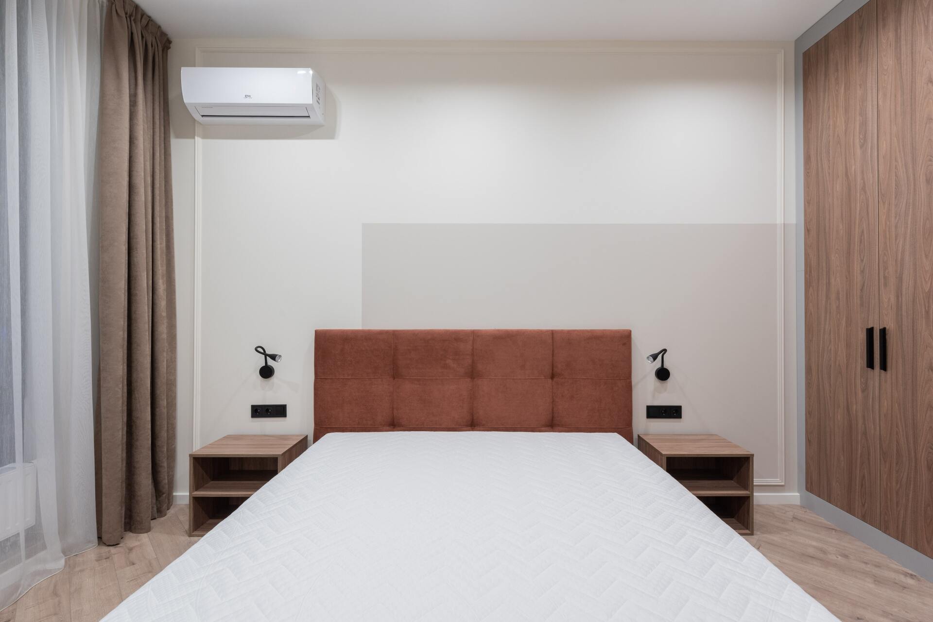 Picture of an air-conditioner in a bedroom.