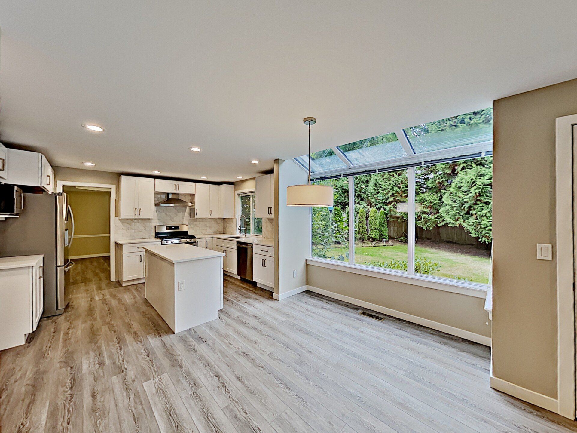 Picture of a kitchen with vinyl plank flooring.