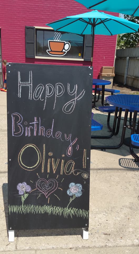happy birthday olivia written on black board