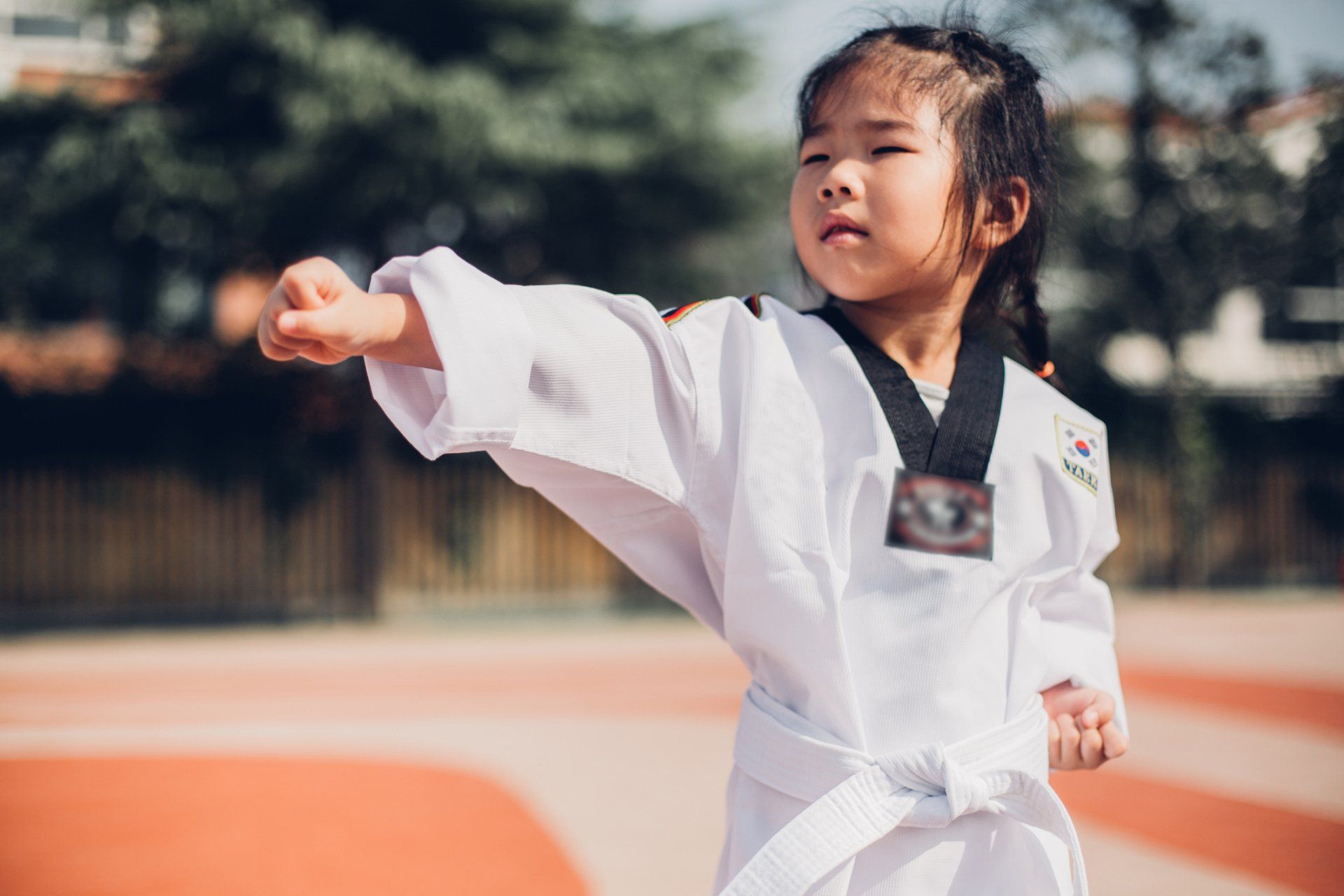 Little Girl Throws a Punch — Agawam, MA — Agawam U.S. Taekwondo Center
