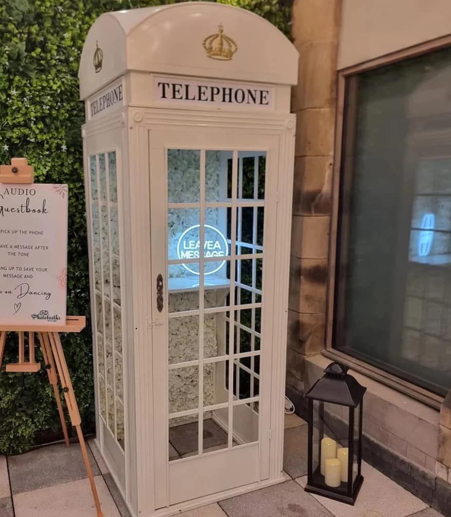 White phone booth photo booth with 