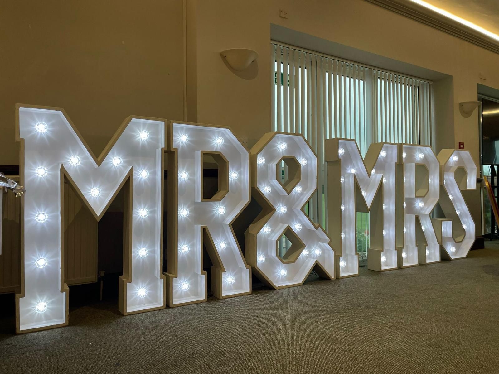 Lit-up marquee letters spelling 