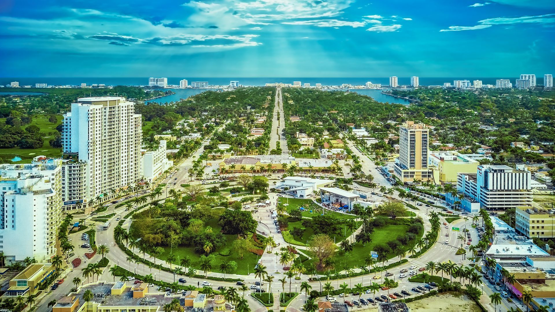 An aerial view of a city with a circle in the middle of it.