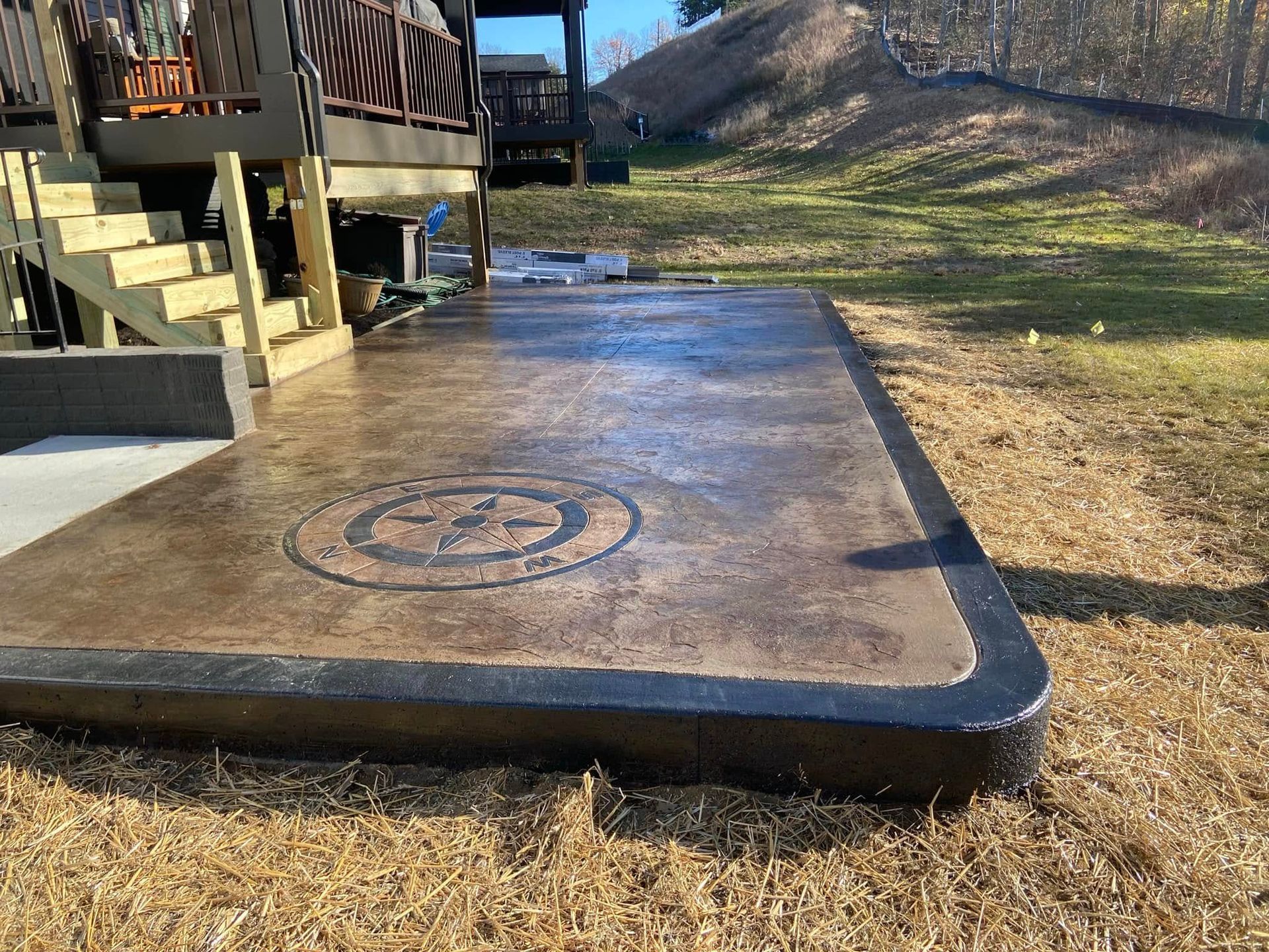 A concrete patio with a star design on it
