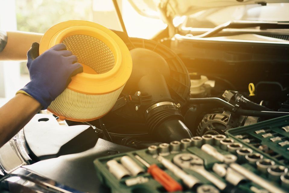 Mechanic Replacing Air Filter — Car Servicing in Aitkenvale, QLD