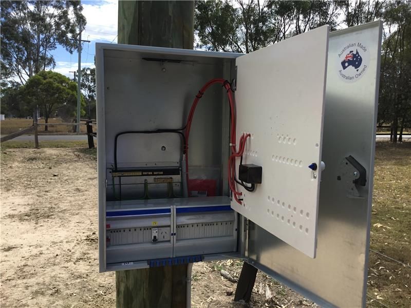 Metal Electrical Box, Open, Mounted on a Pole Outdoors — Carl Voss-Electrician In Urangan, QLD