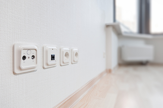 White Wall With Four Electrical Sockets — Carl Voss-Electrician In Urangan, QLD