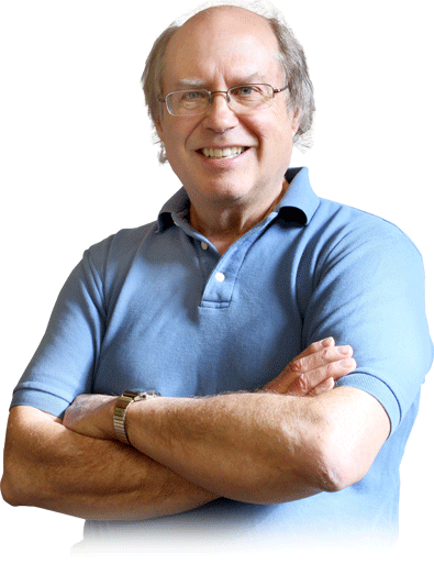 A bald man wearing glasses and a blue shirt with his arms crossed