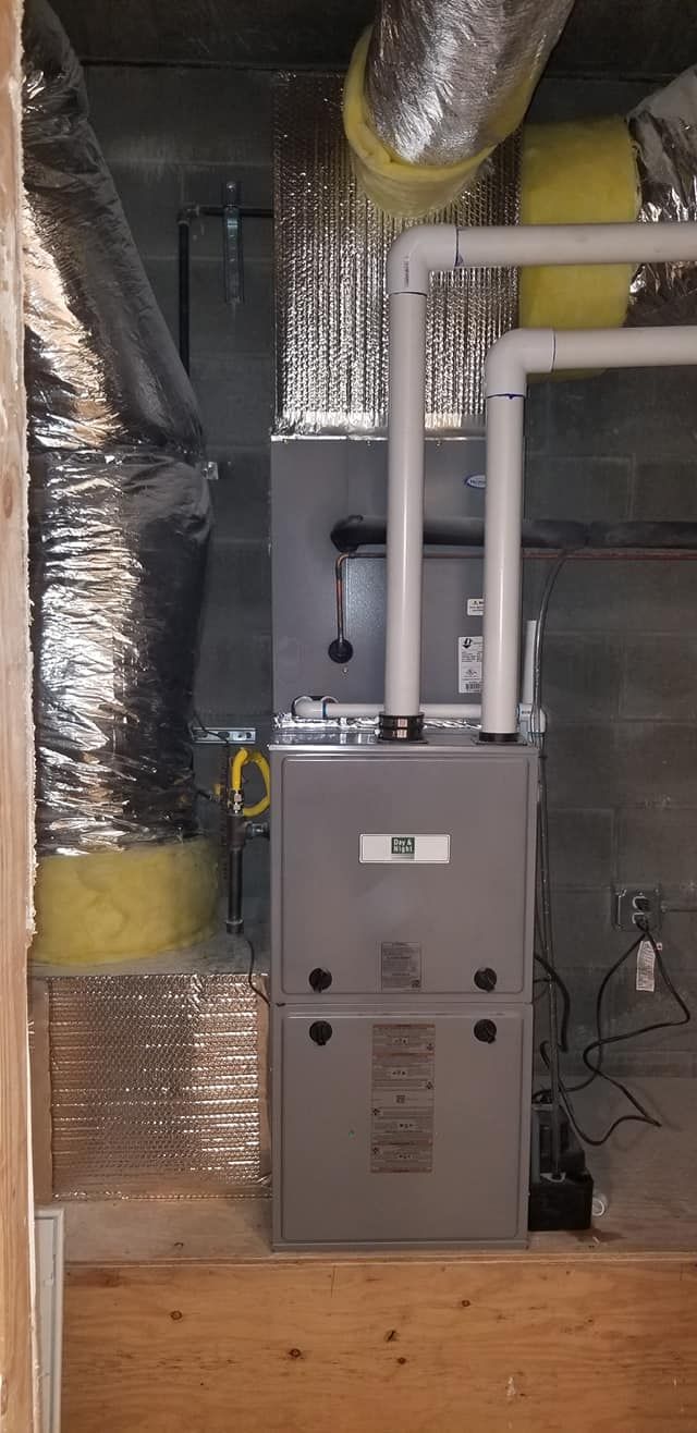 A heating and cooling system is installed in a basement.