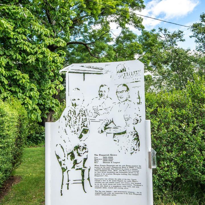 a photo showing a special metal sign with historical information on it. this is part of the westbury histoical walk