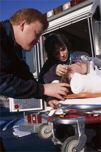 Personal Injury - Medical Staffs Giving First Aid To An Injured Person in Centerreach, NY