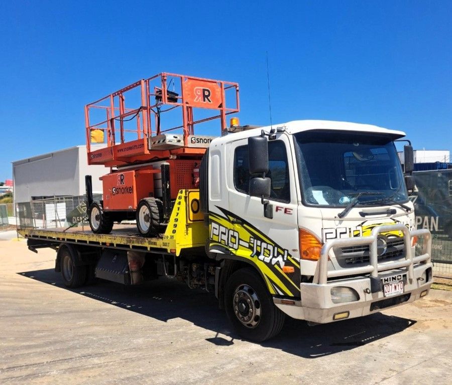 A Tow Truck With a Lift on the Back is Parked in a Parking Lot— Pro-Tow Toowoomba in Wilsonton, QLD