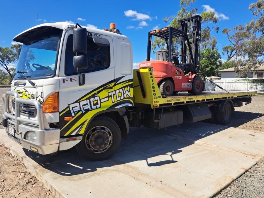 A Tow Truck With a Forklift on the Back of It — Pro-Tow Toowoomba in Wilsonton, QLD
