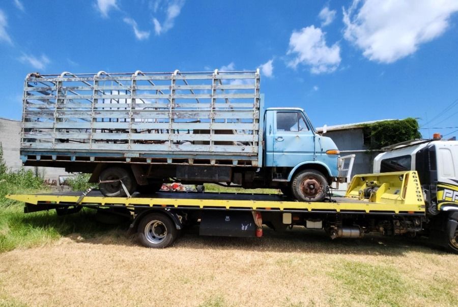 A Blue Truck is Sitting on Top of a Yellow Tow Truck — Pro-Tow Toowoomba in Wilsonton, QLD