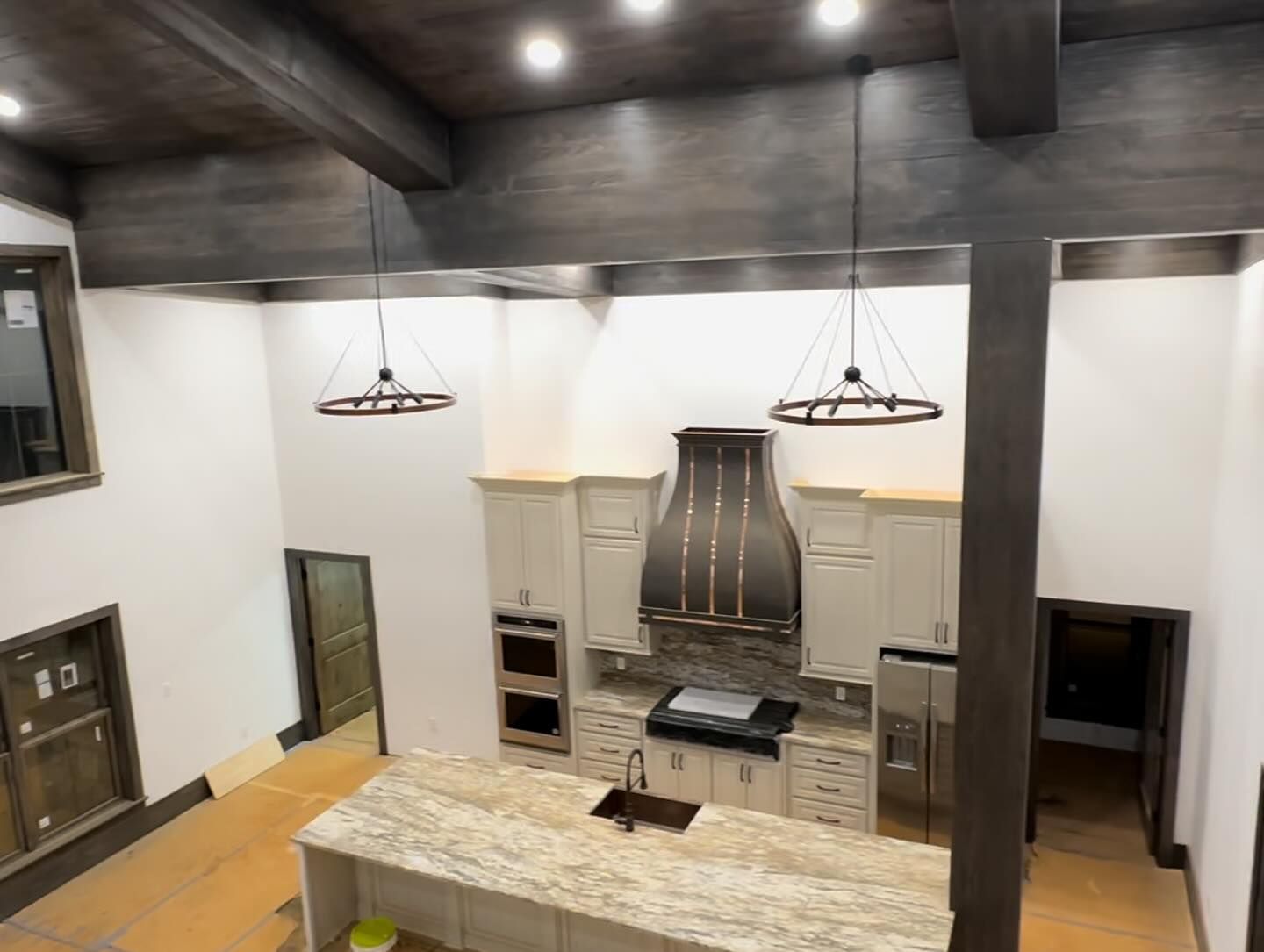 An aerial view of a kitchen with a large island in the middle.