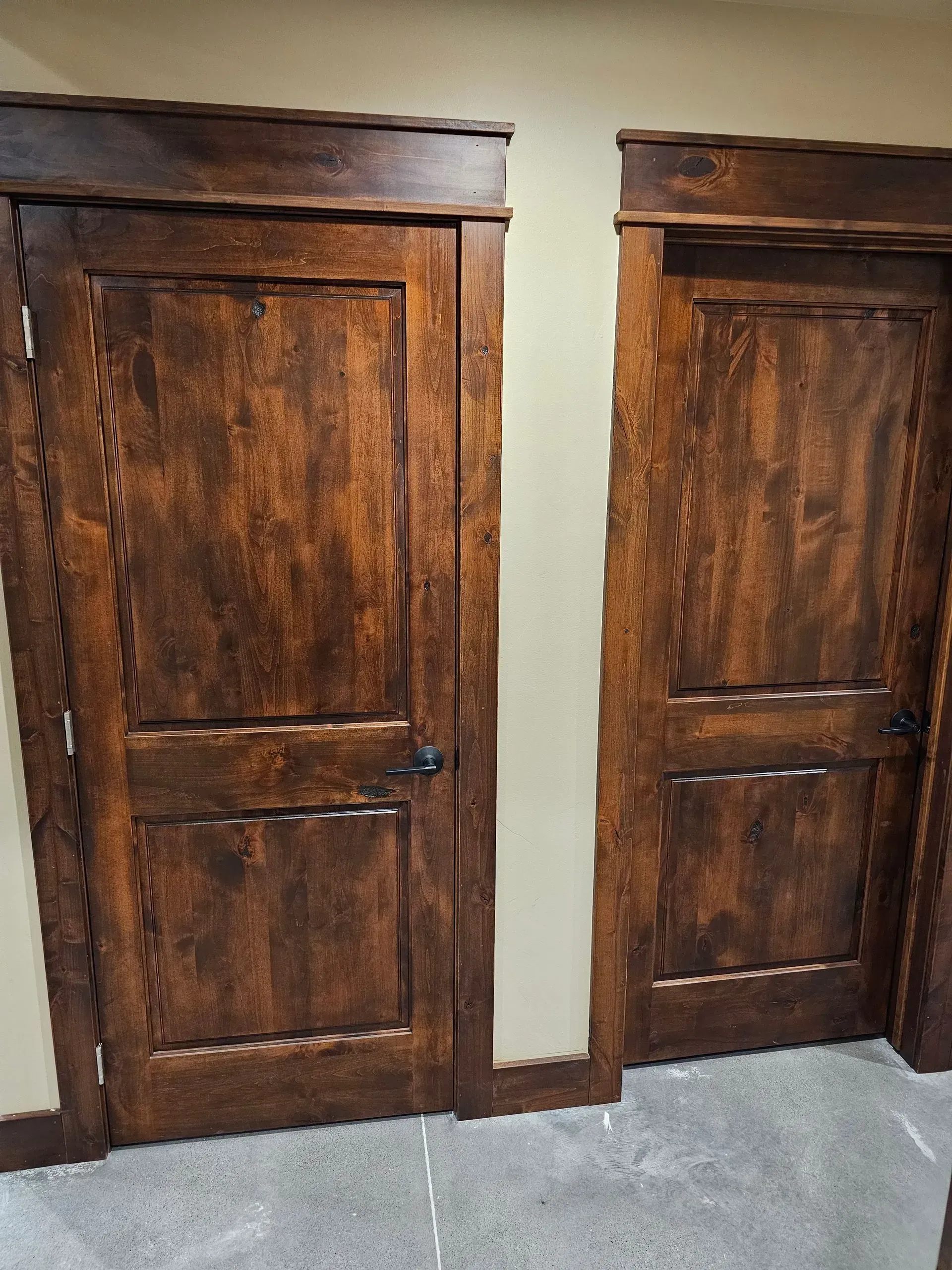 A pair of brown wooden doors in a room