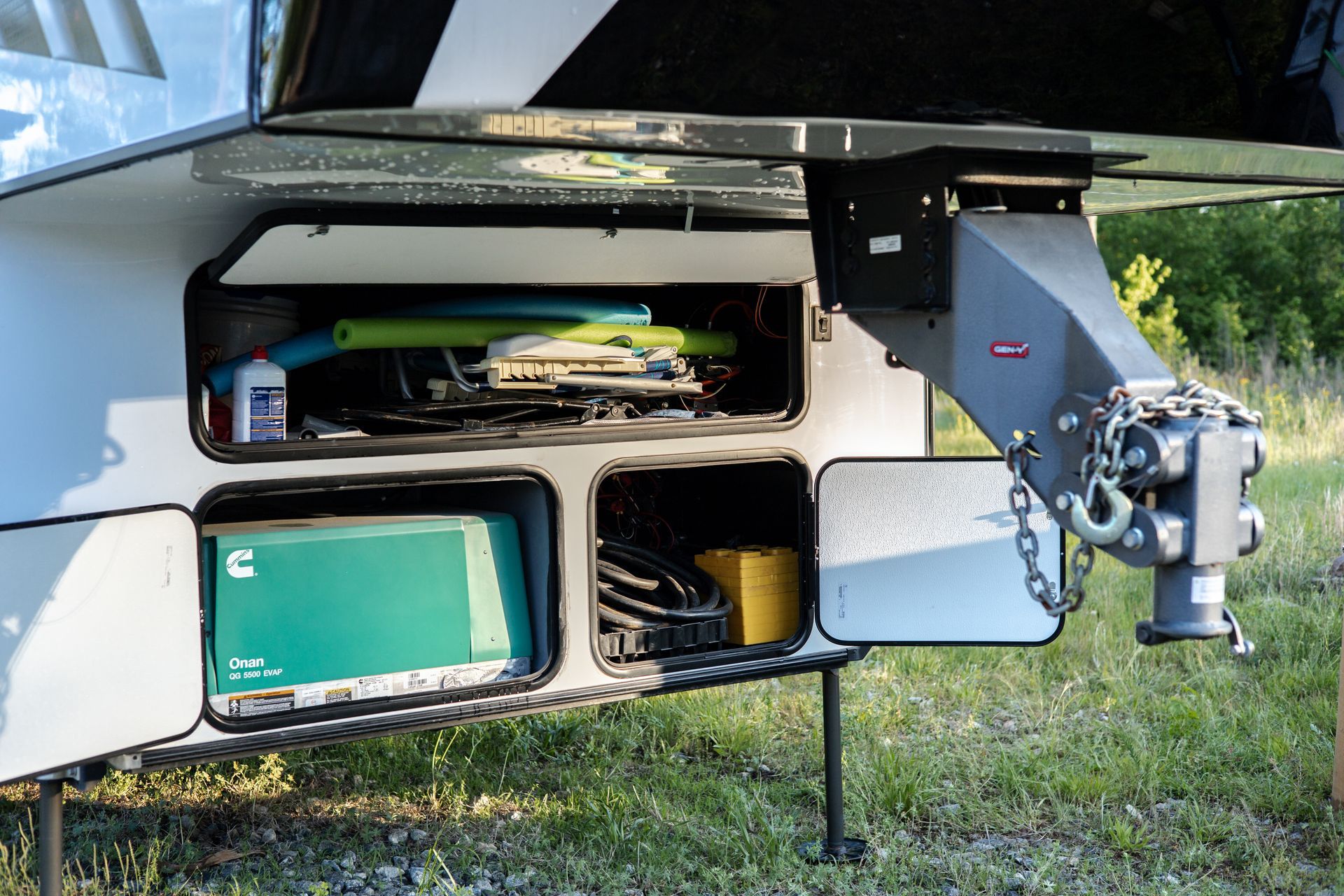 A trailer with a green box in the back of it