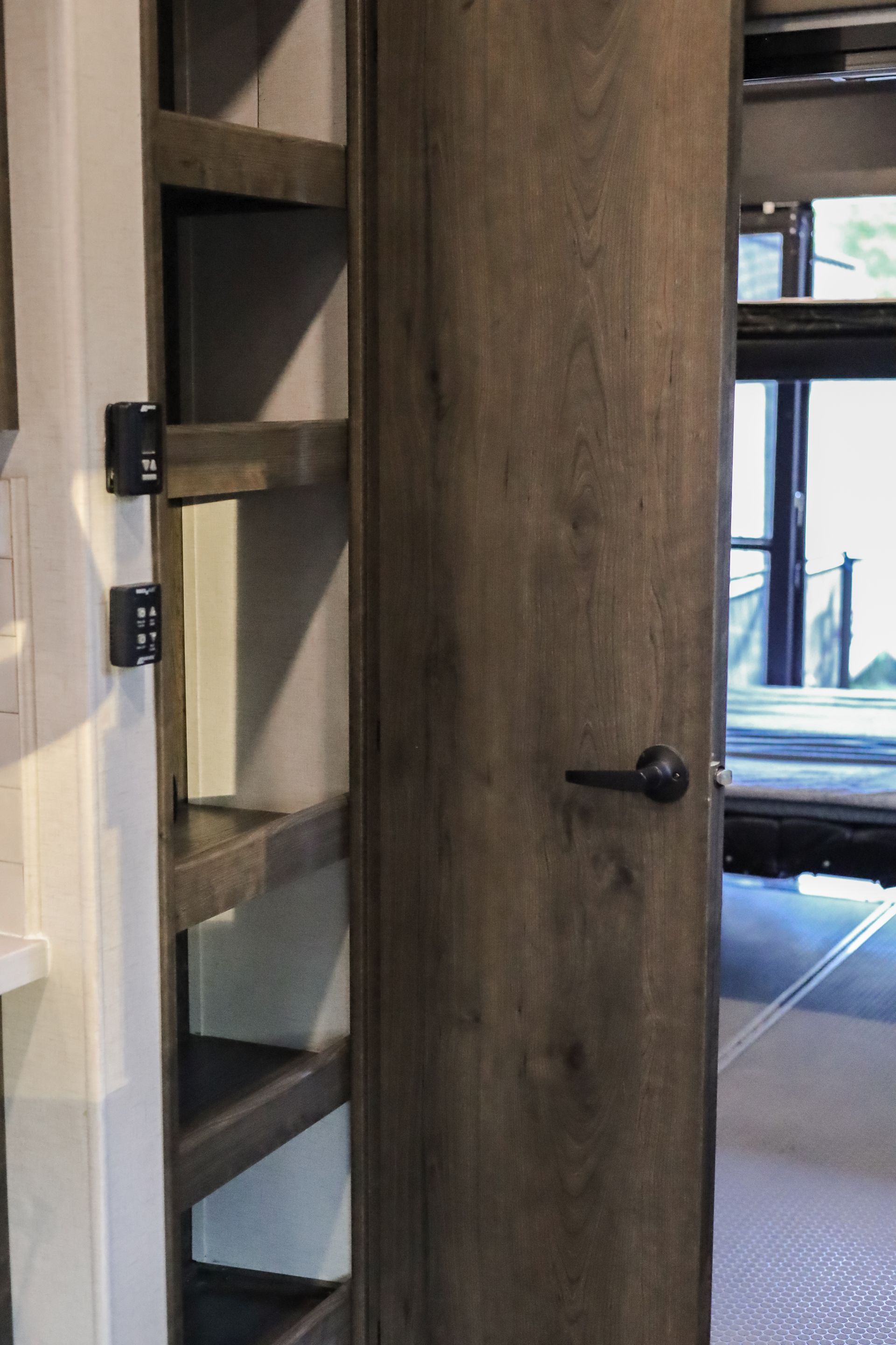A close up of a wooden door in a room.