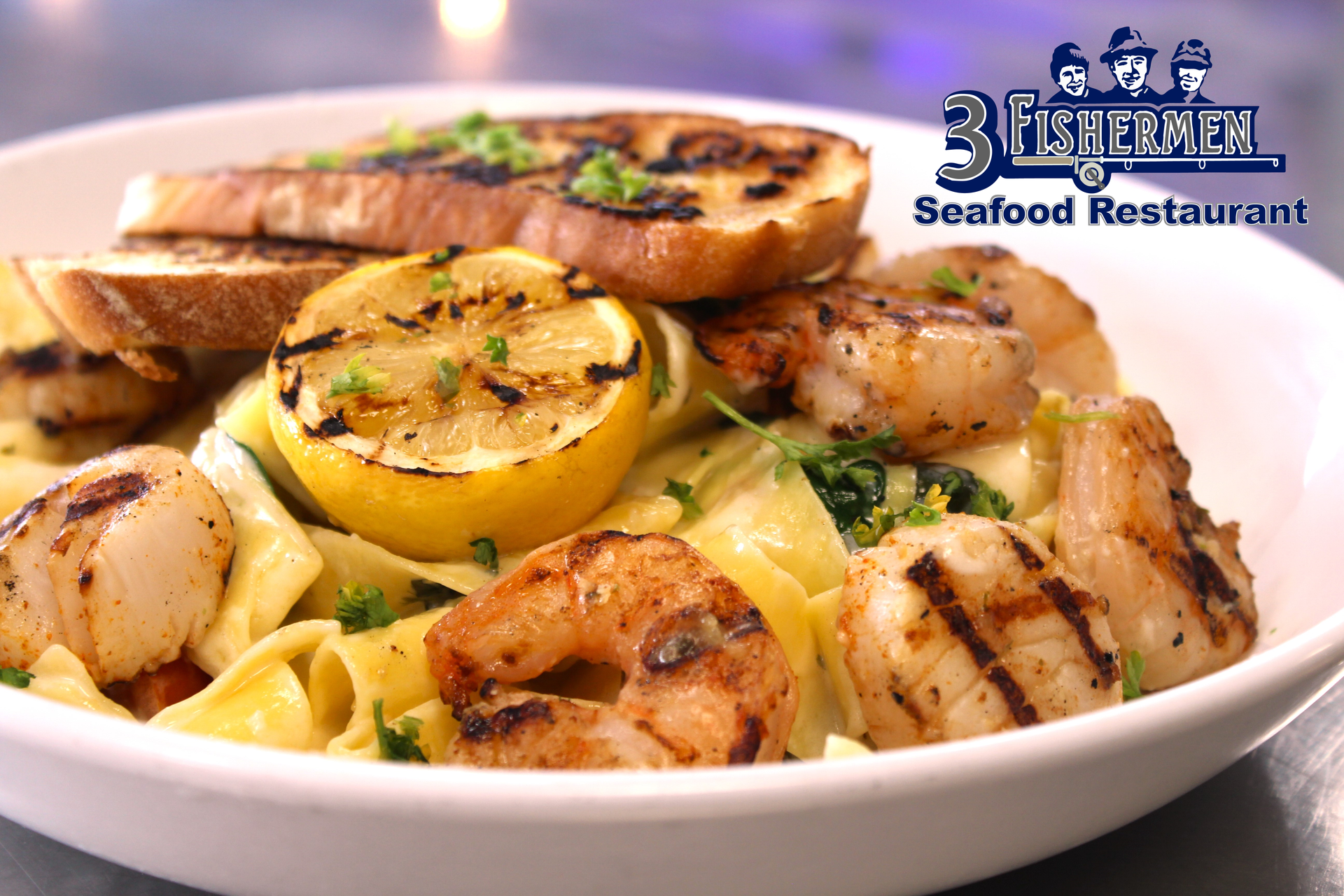 A close up of a plate of food that says 3 fishes on it