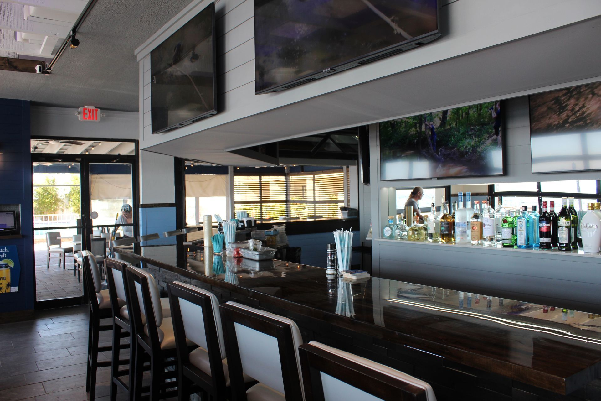 A bar with a lot of bottles of liquor on it