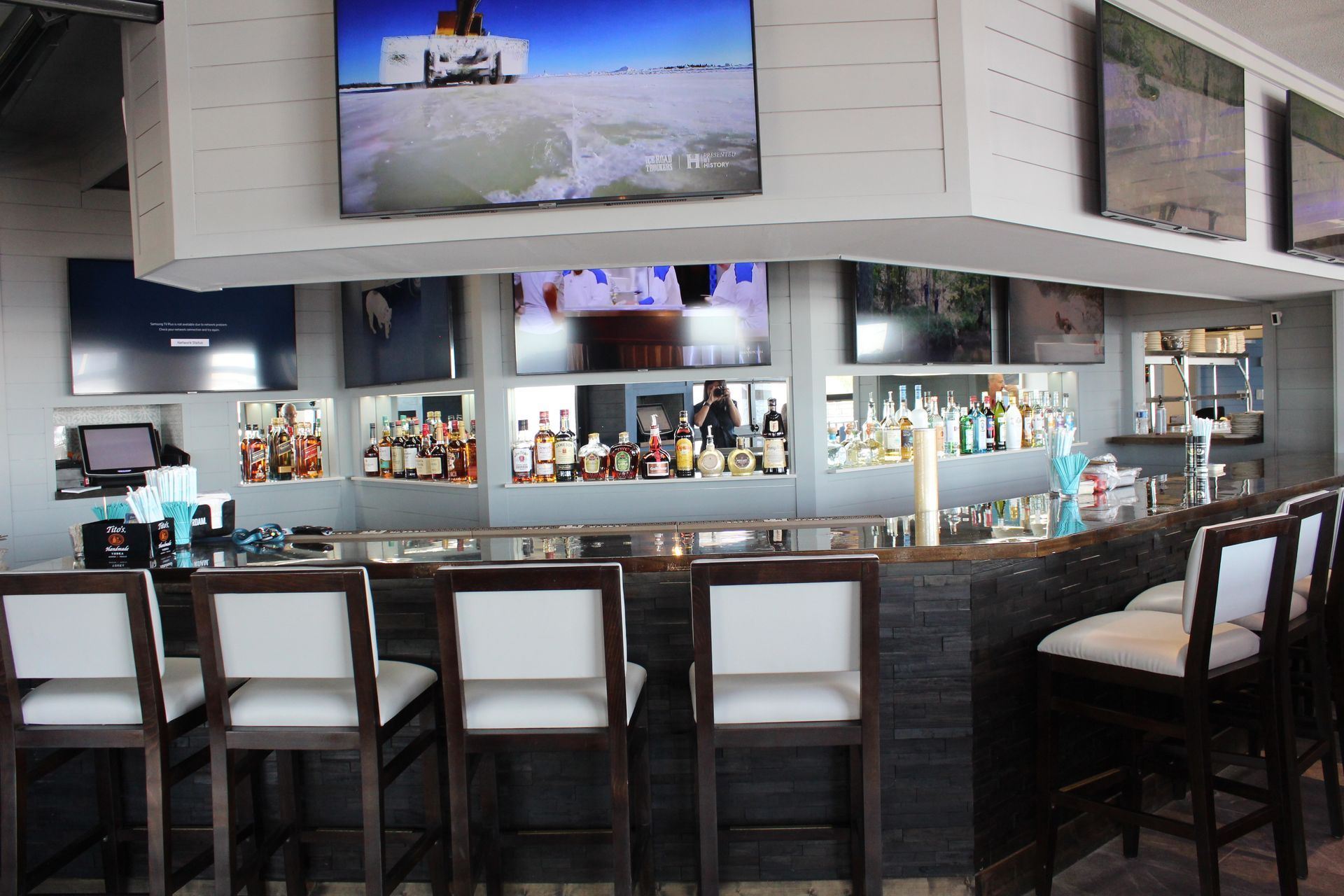 A bar with a lot of bottles on it