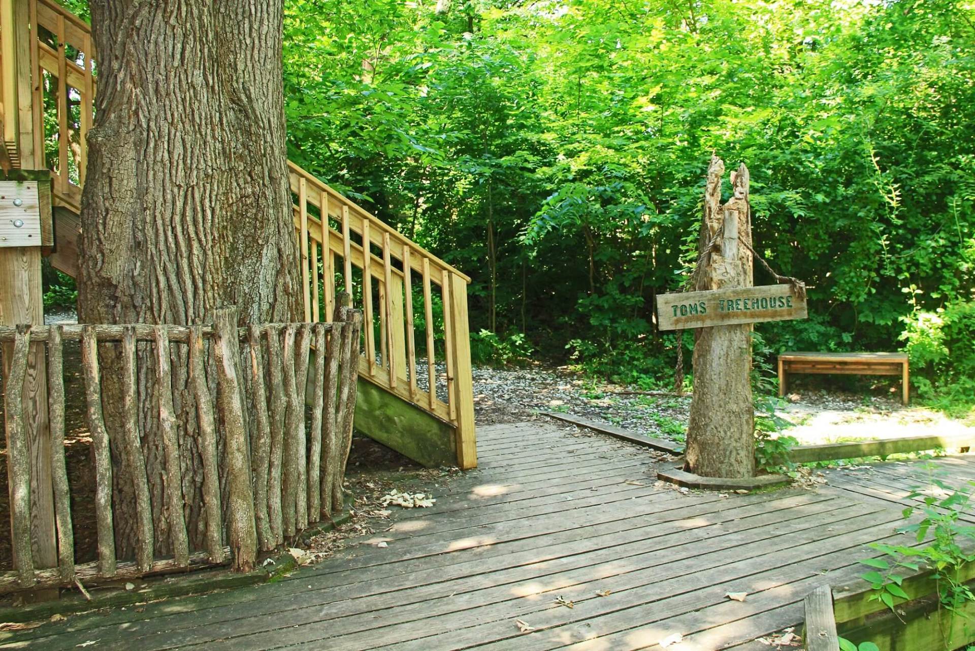 A wooden walkway with a sign that says lake erie