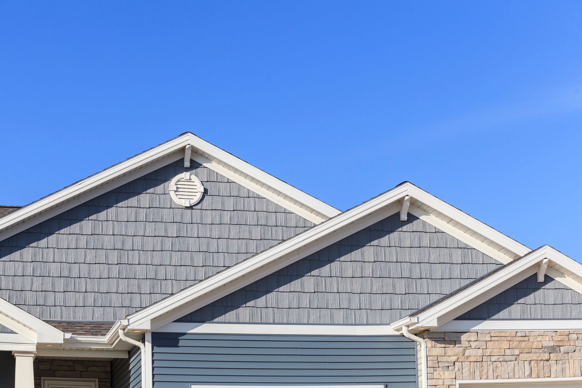 Home with flawless roofing and siding, siding contractor quality work shown.
