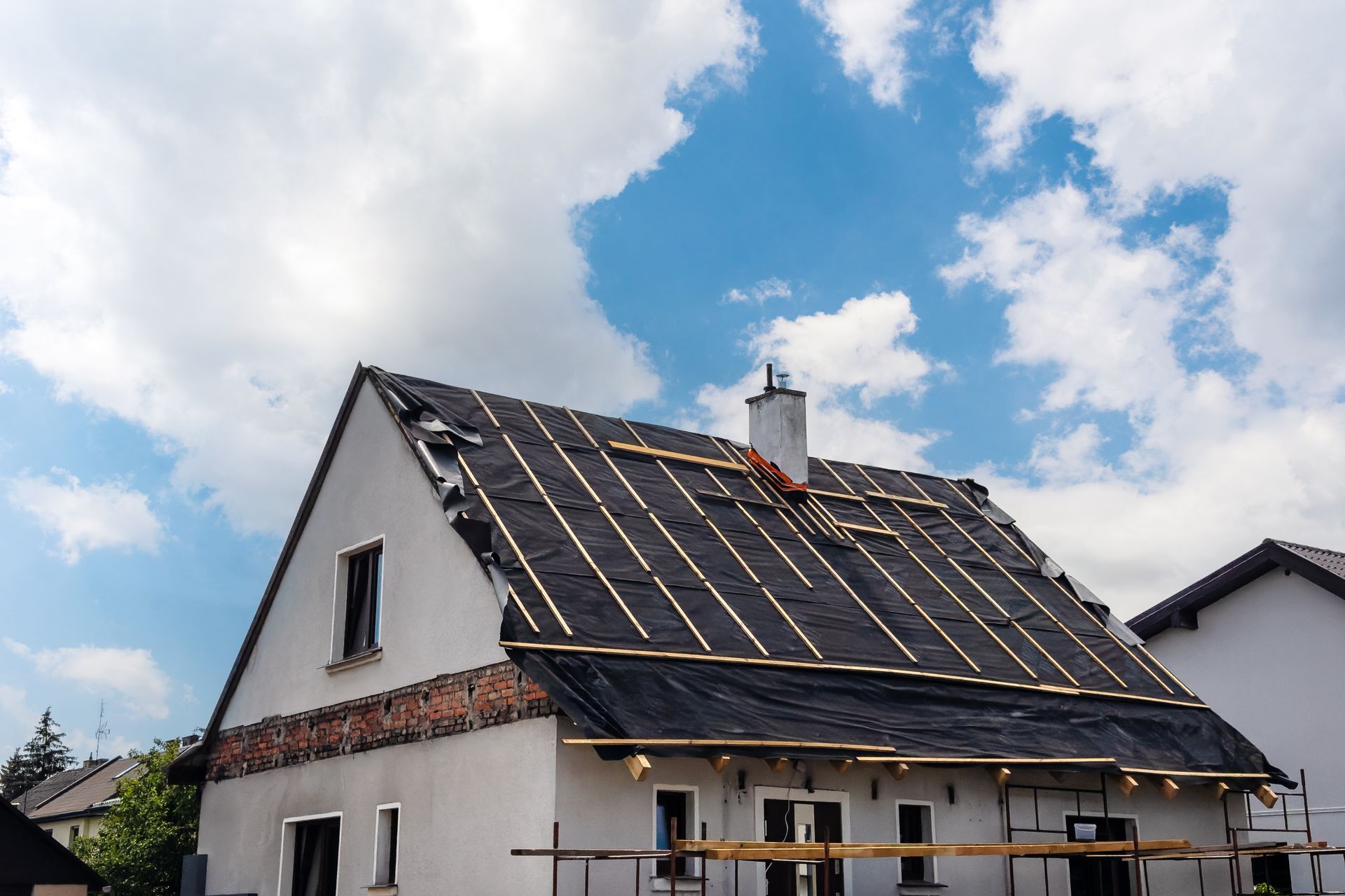 Process of installing new roofing materials.